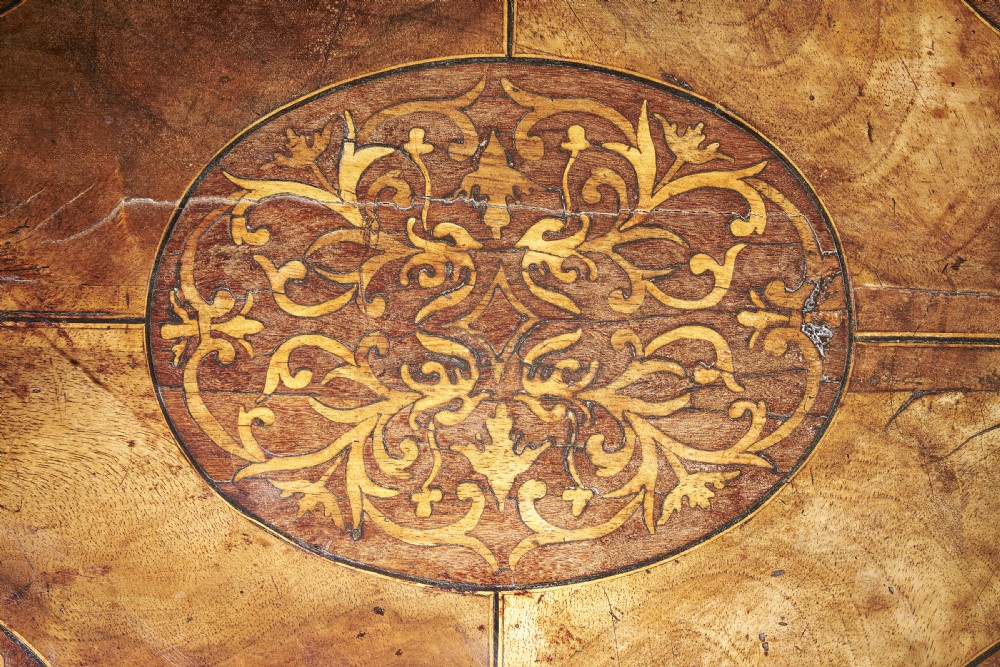 A rectangular seventeenth-century figured walnut box featuring intricate seaweed marquetry in an oval central cartouche and matching corner panels. View IV