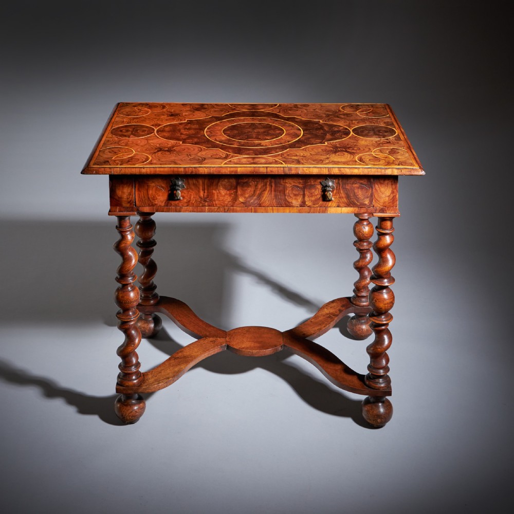 A late 17th-century William and Mary side table featuring intricate olive wood oyster veneering, barley-twist legs, an X-frame stretcher, and a frieze drawer. View II