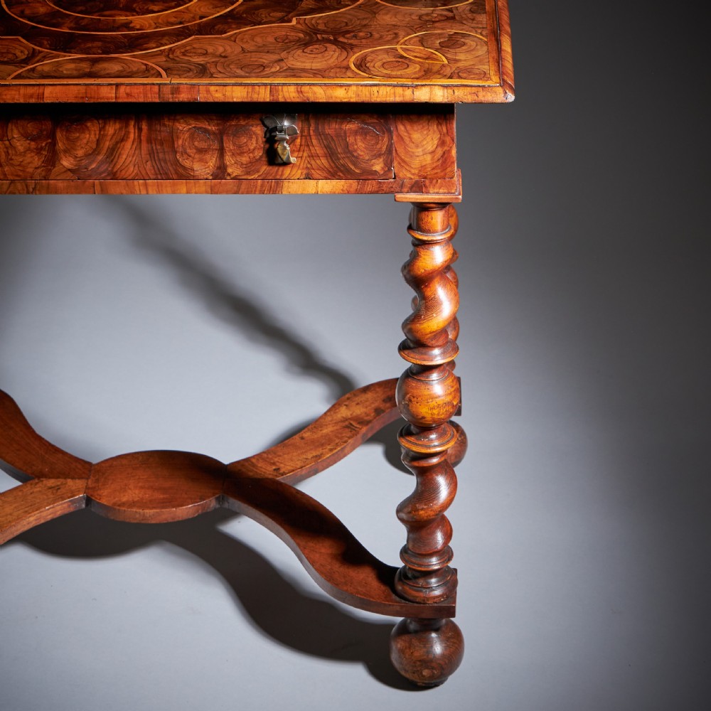 A late 17th-century William and Mary side table featuring intricate olive wood oyster veneering, barley-twist legs, an X-frame stretcher, and a frieze drawer. View III