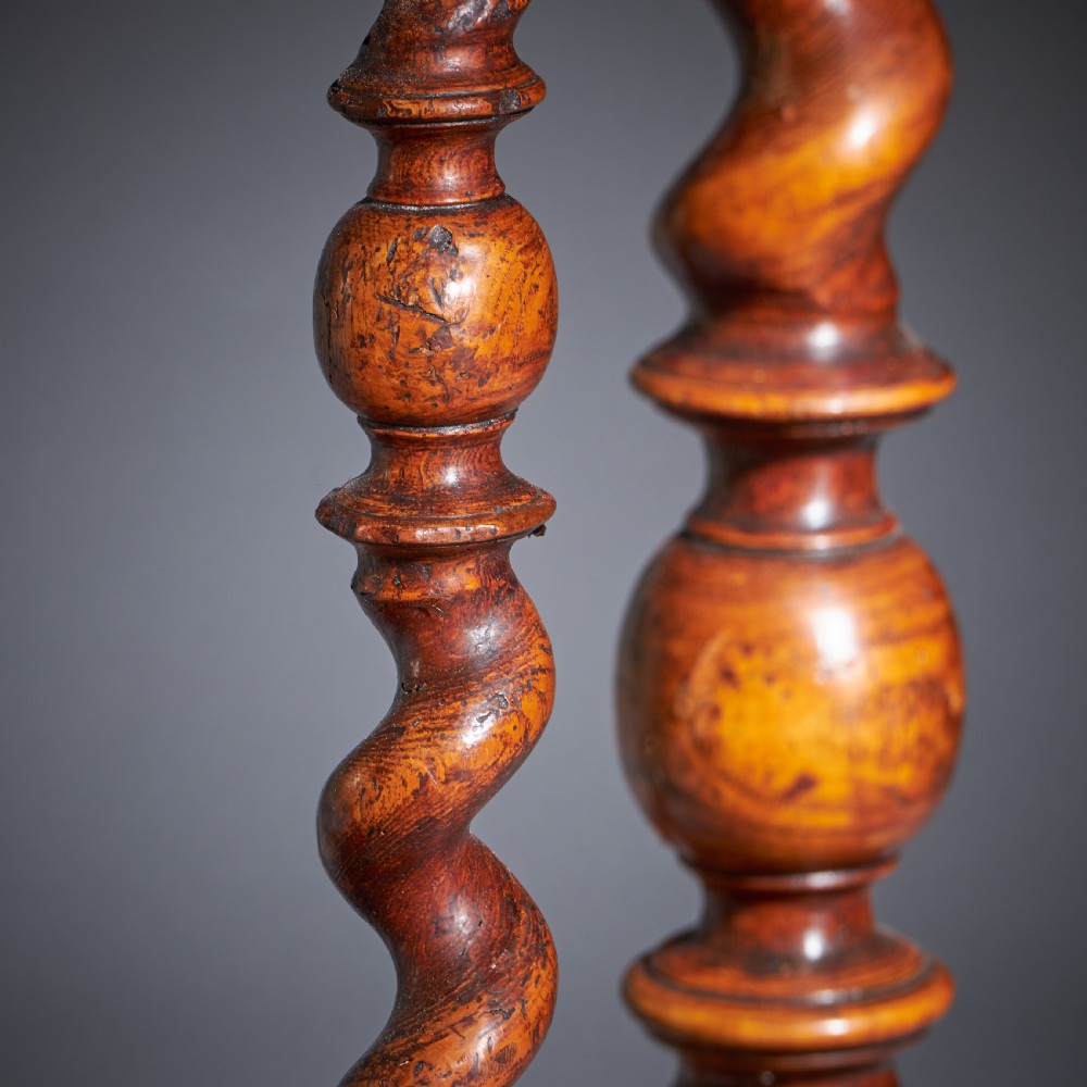 A late 17th-century William and Mary side table featuring intricate olive wood oyster veneering, barley-twist legs, an X-frame stretcher, and a frieze drawer. View IX