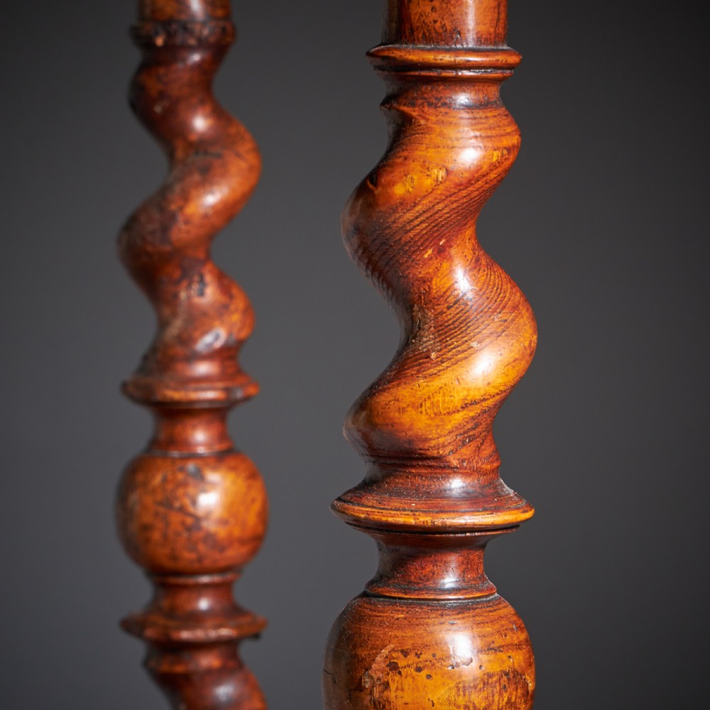 A late 17th-century William and Mary side table featuring intricate olive wood oyster veneering, barley-twist legs, an X-frame stretcher, and a frieze drawer. View XII