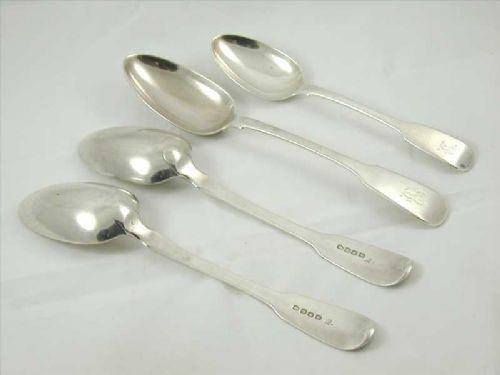 fig 1. A set of four antique sterling silver spoons featuring three larger serving spoons and one smaller dessert spoon with polished finish and terminal engravings.