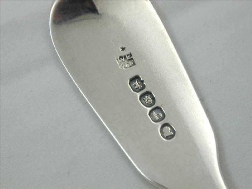 fig 2. A set of four antique sterling silver spoons featuring three larger serving spoons and one smaller dessert spoon with polished finish and terminal engravings.