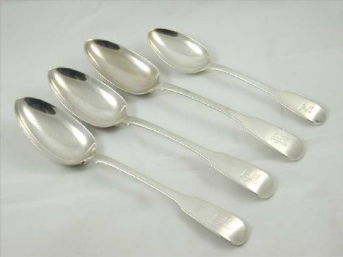 fig 4. A set of four antique sterling silver spoons featuring three larger serving spoons and one smaller dessert spoon with polished finish and terminal engravings.