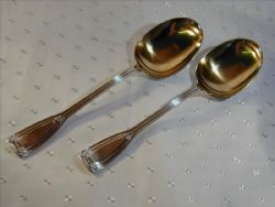 TIFFANY CO STERLING SILVER PAIR OF SERVING SPOONS WITH SAINT DUNSTAN PATTERN