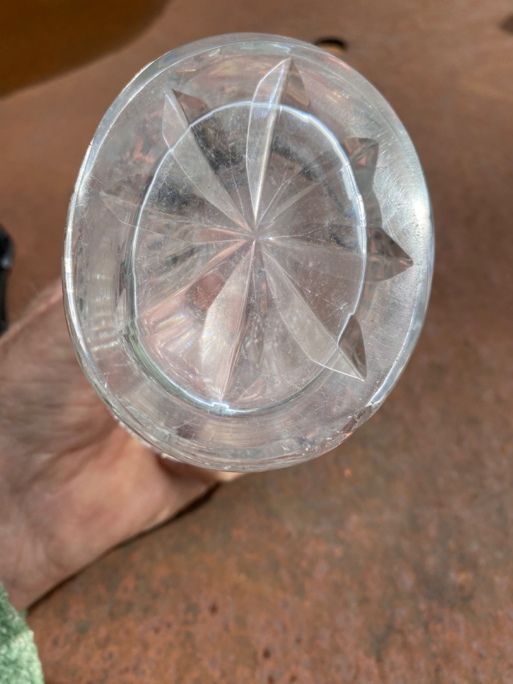 A clear 19th-century cut glass spirit decanter featuring diamond-patterned relief carvings and a fitted circular cut stopper. View VIII