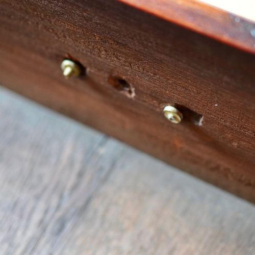 fig 1. A late 18th-century George III mahogany chest on chest featuring brass swan-neck handles, keyhole escutcheons, dentil moulding, and bracket feet.
