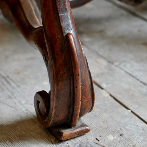 fig 7. A pair of late 19th-century French walnut side chairs with high upholstered backs in a leafy green tapestry fabric and carved curved legs.