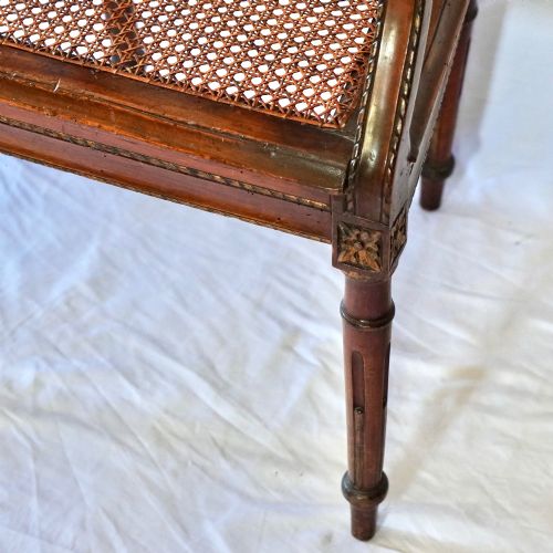fig 8. A matching pair of 19th-century Regency style mahogany armchairs featuring carved lyre back splats and woven cane seats.