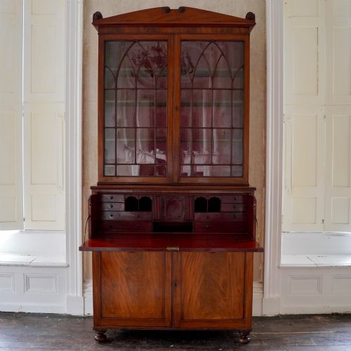 GEORGE IV FIGURED MAHOGANY SECRETAIRE BOOKCASE