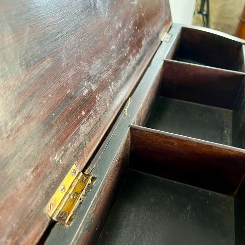 fig 2. A dark mahogany serpentine-front side cabinet with hand-painted floral swags and figurative door panel vignettes resting on slender square tapered legs.