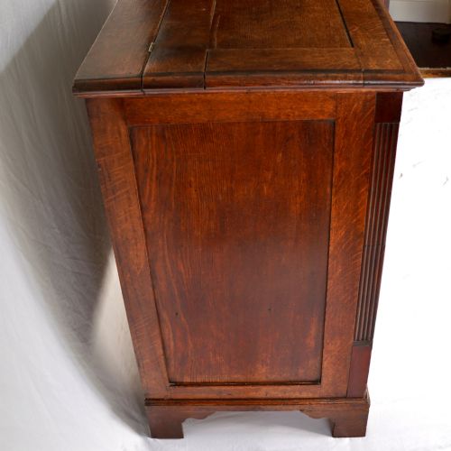 fig 3. A Georgian oak and mahogany crossbanded Lancashire mule chest with brass handles and bracket feet.