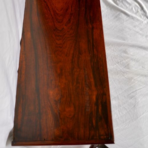 fig 7. A Regency period dark rosewood tabletop collectors cabinet featuring twin banks of small drawers flanking a central mirrored shelf unit with Gothic arched carving.