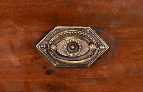 fig 6. A large George IV mahogany breakfront library bookcase featuring gothic astragal glazed upper doors above drawers and cupboard doors with geometric moulding.