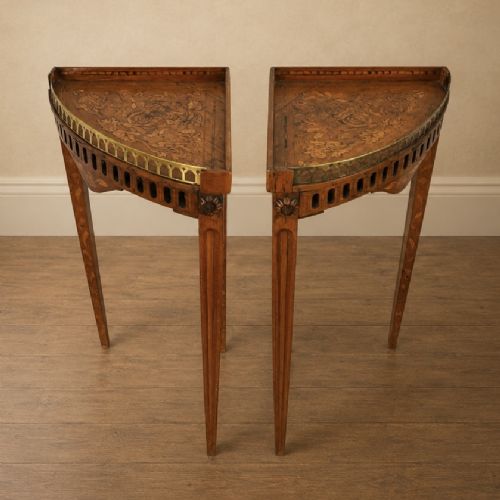 fig 1. A pair of 18th-century triangular corner tables featuring detailed floral marquetry top surfaces, pierced friezes, tapering legs, and brass galleries.