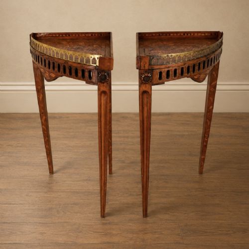 fig 6. A pair of 18th-century triangular corner tables featuring detailed floral marquetry top surfaces, pierced friezes, tapering legs, and brass galleries.