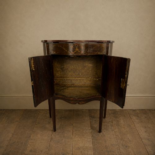 fig 7. A dark mahogany serpentine-front side cabinet with hand-painted floral swags and figurative door panel vignettes resting on slender square tapered legs.