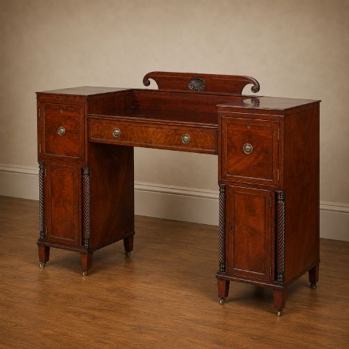 fig 2. A Regency figured mahogany pedestal sideboard with spiral-turned columns, brass drop handles, and a central carved splashback.