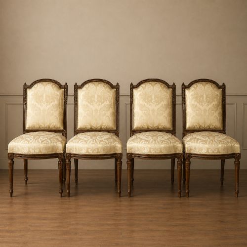 Set of Four Louis Xvi-style French Walnut and Parcel Gilt Side Chairs