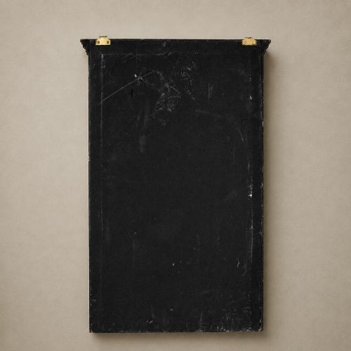 fig 6. An ebonised black wooden wall cabinet featuring an arched door panel decorated with a hand-painted exotic bird amongst green foliage.