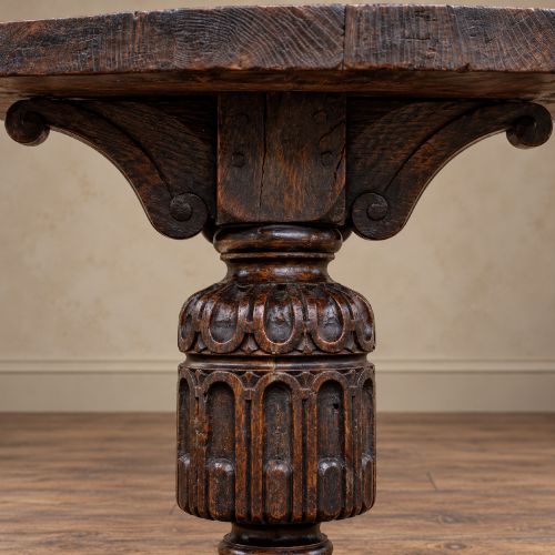 fig 2. A 17th-century oak and elm refectory dining table featuring a solid single-plank top over thick carved bulbous pedestal supports and a low central stretcher rail.