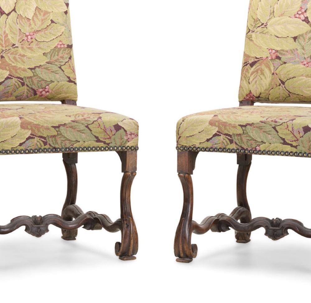A pair of late 19th-century French walnut side chairs with high upholstered backs in a leafy green tapestry fabric and carved curved legs. View II