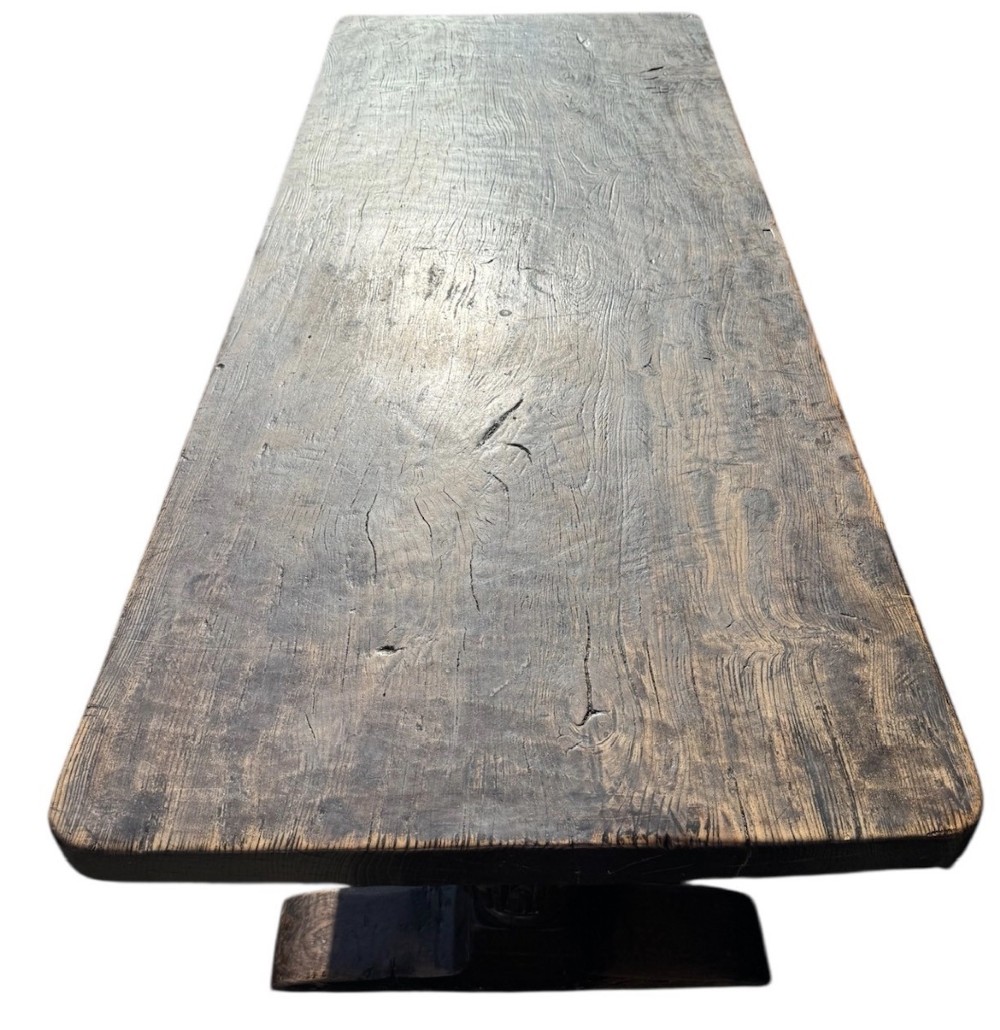 A 17th-century oak and elm refectory dining table featuring a solid single-plank top over thick carved bulbous pedestal supports and a low central stretcher rail. View XII
