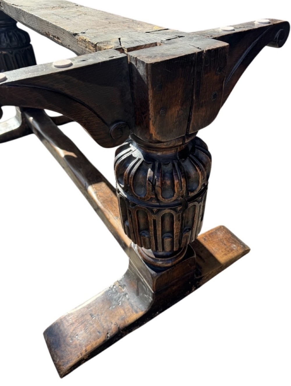 A 17th-century oak and elm refectory dining table featuring a solid single-plank top over thick carved bulbous pedestal supports and a low central stretcher rail. View XIII