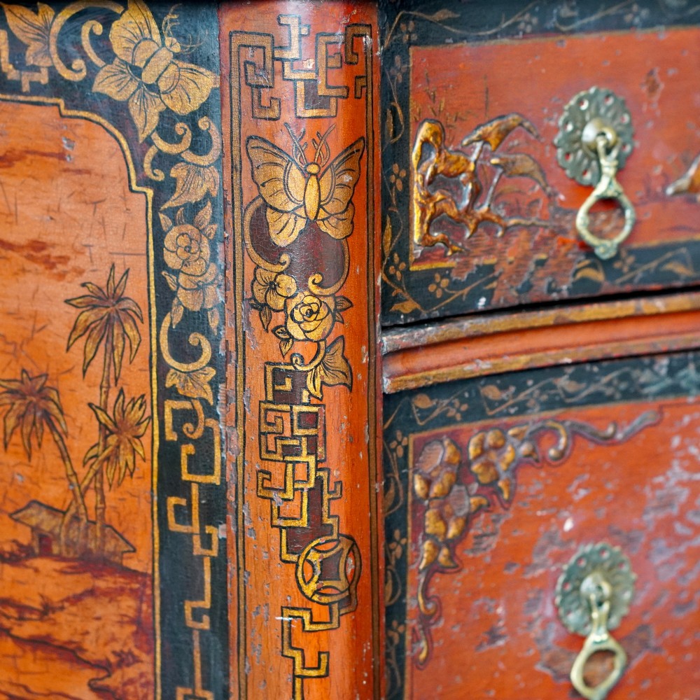A late nineteenth-century kidney-shaped red lacquered Chinoiserie dressing table featuring four drawers, hand-painted oriental scenes, and cabriole legs. View II