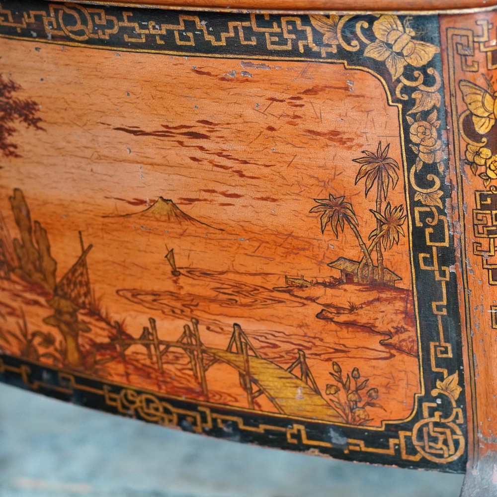 A late nineteenth-century kidney-shaped red lacquered Chinoiserie dressing table featuring four drawers, hand-painted oriental scenes, and cabriole legs. View VII