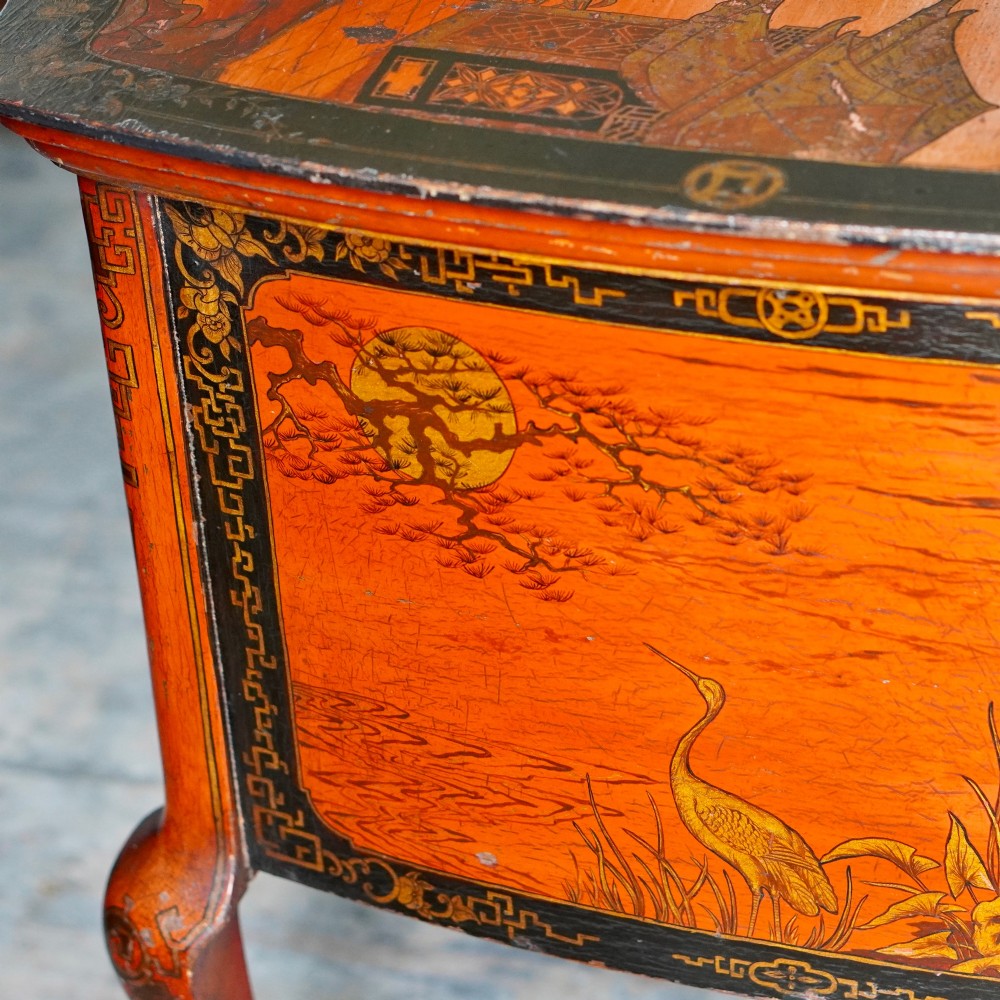 A late nineteenth-century kidney-shaped red lacquered Chinoiserie dressing table featuring four drawers, hand-painted oriental scenes, and cabriole legs. View XI
