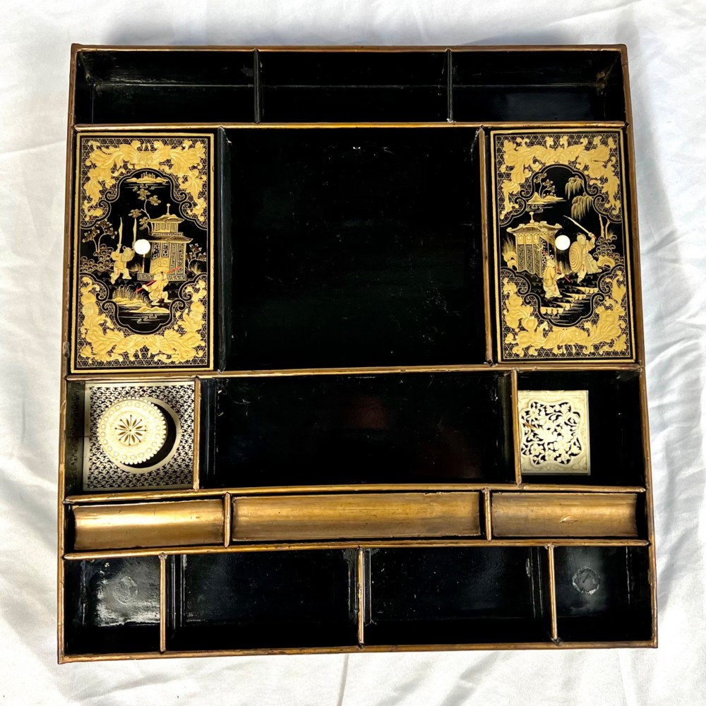 A Regency era black lacquered work table featuring detailed gold chinoiserie motifs, turned legs, a stretcher base, and carved paw feet. View VIII