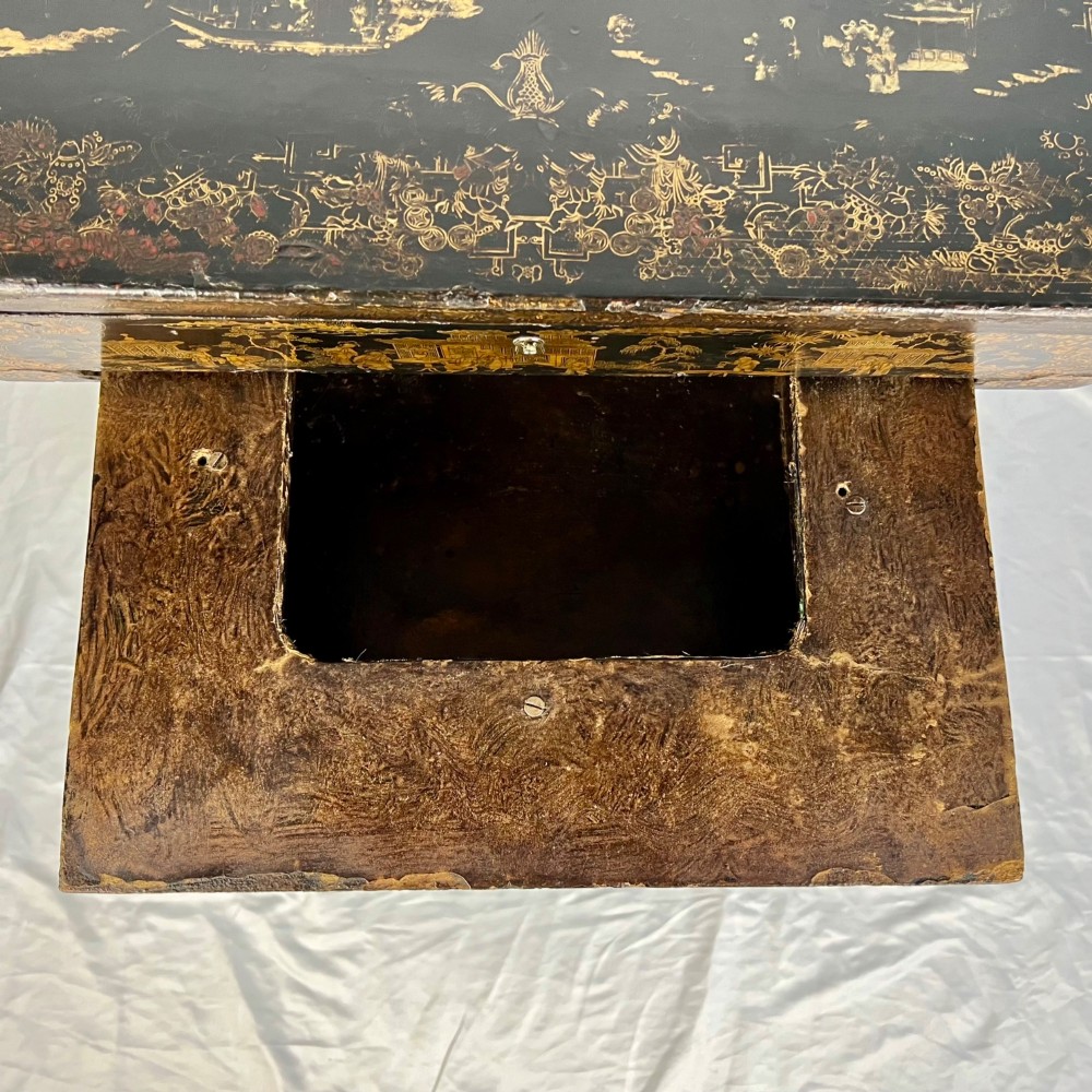 A Regency era black lacquered work table featuring detailed gold chinoiserie motifs, turned legs, a stretcher base, and carved paw feet. View XII