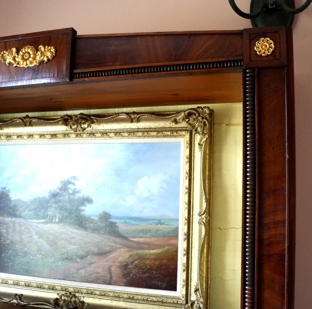 A nineteenth-century French Empire style rosewood open bookcase featuring brass mounts and adjustable shelves above vertical dividers. View IV