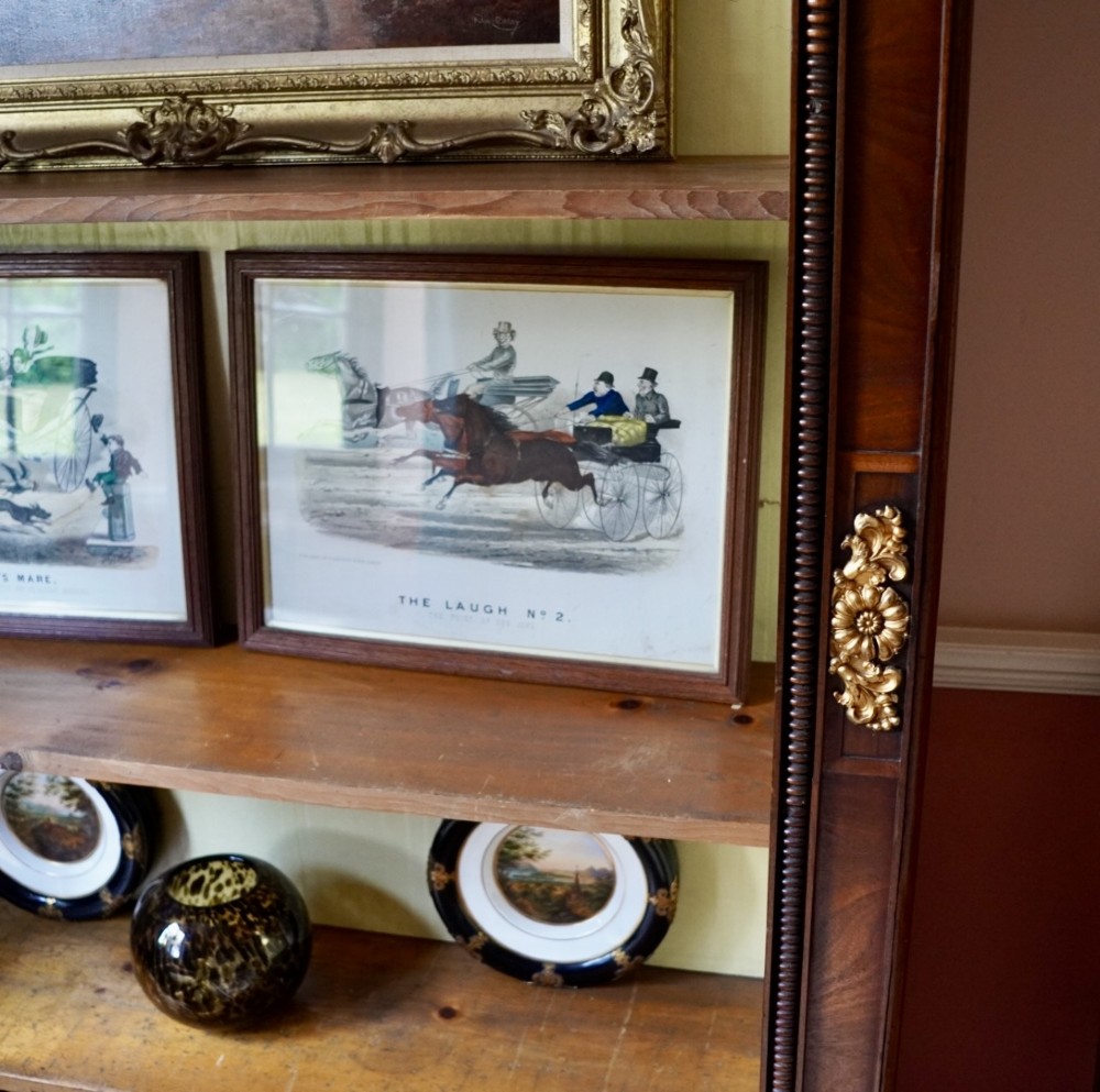 A nineteenth-century French Empire style rosewood open bookcase featuring brass mounts and adjustable shelves above vertical dividers. View VI