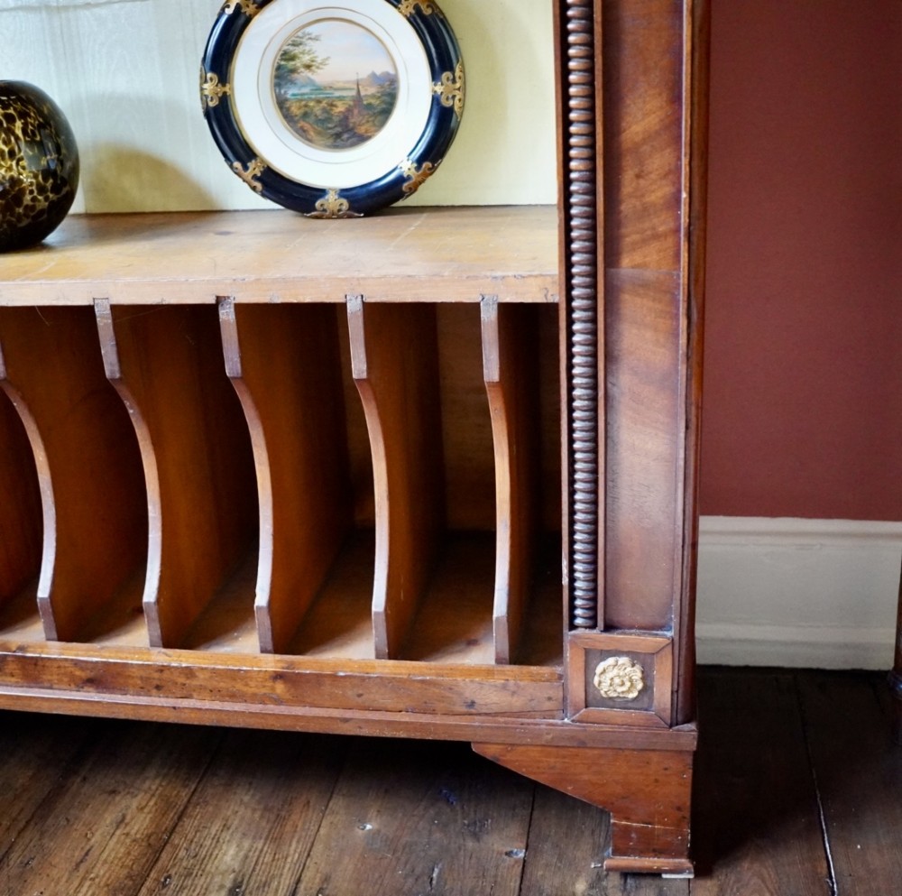 A nineteenth-century French Empire style rosewood open bookcase featuring brass mounts and adjustable shelves above vertical dividers. View VII