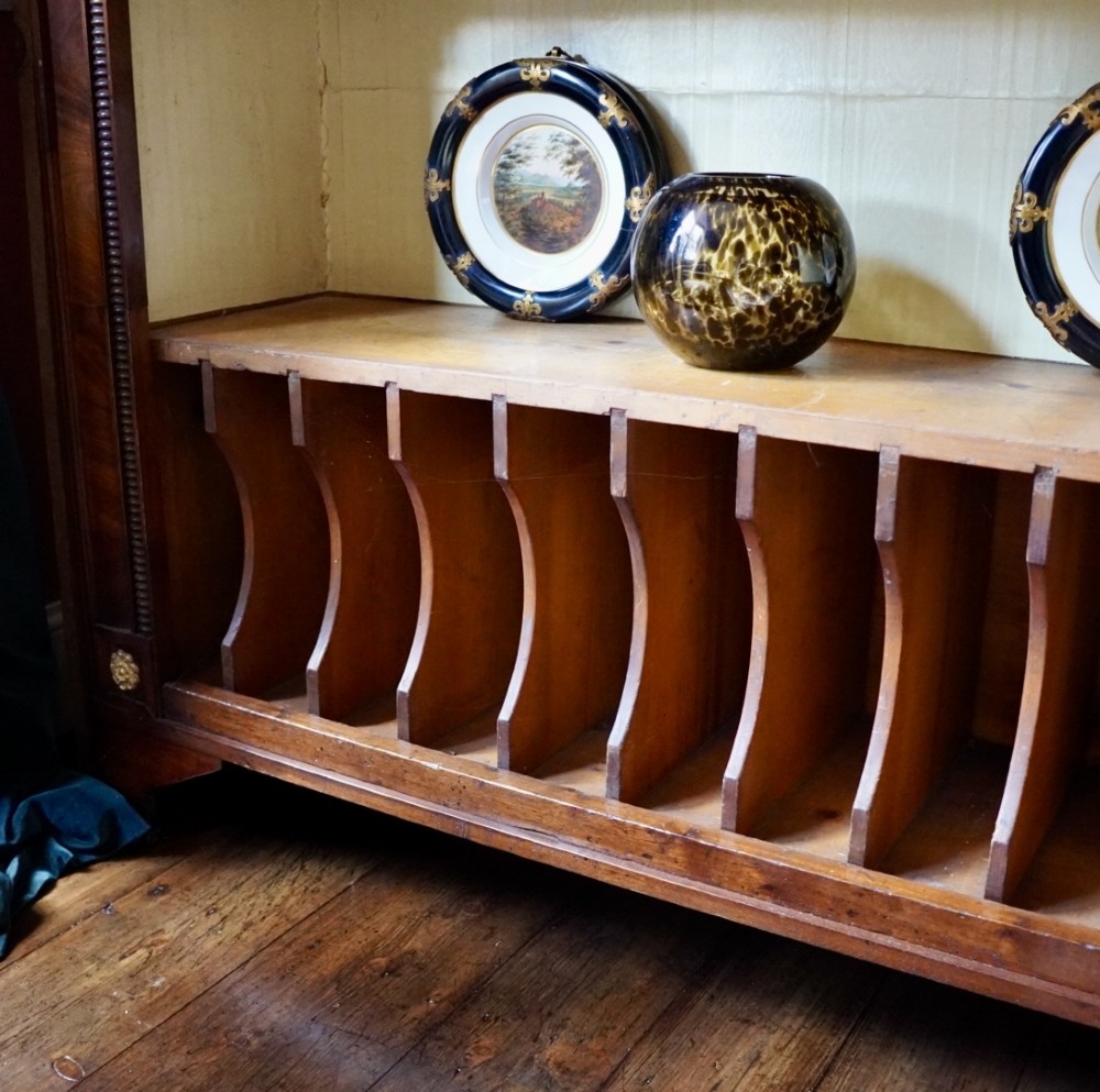A nineteenth-century French Empire style rosewood open bookcase featuring brass mounts and adjustable shelves above vertical dividers. View VIII