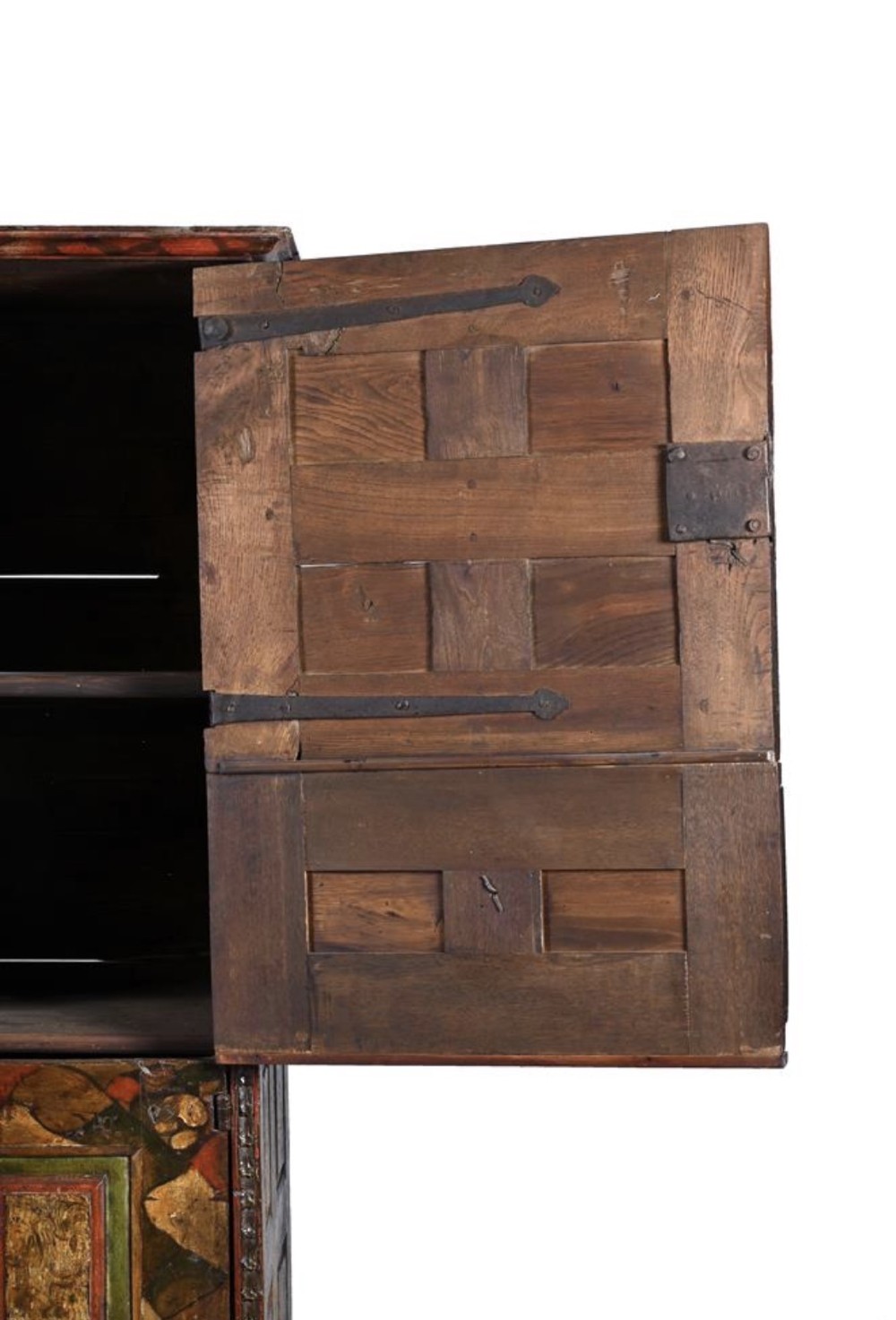 A tall seventeenth-century Spanish oak press cupboard featuring double upper and lower doors decorated with geometric raised panels and painted polychrome geometric patterns. View IX