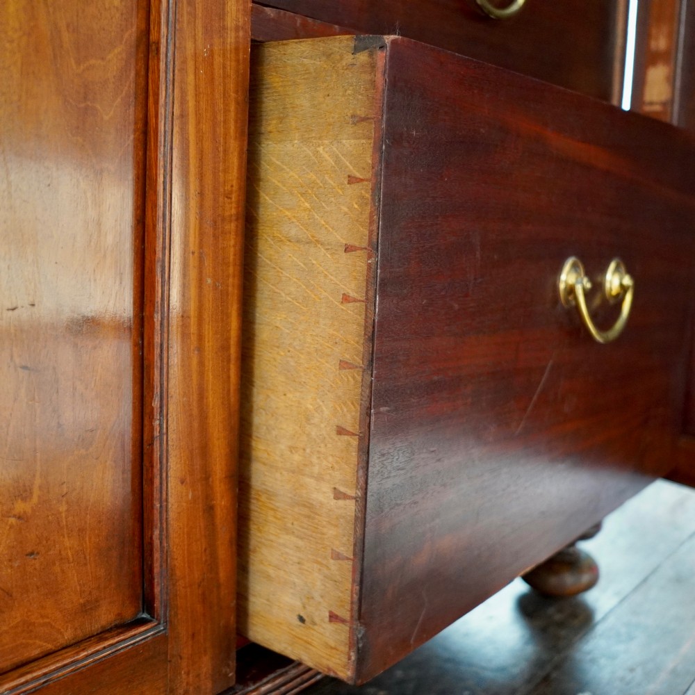 A nineteenth-century George IV mahogany secretaire bookcase with glazed upper doors featuring gothic tracery and a drop-down desk drawer revealing a fitted interior. View XIV