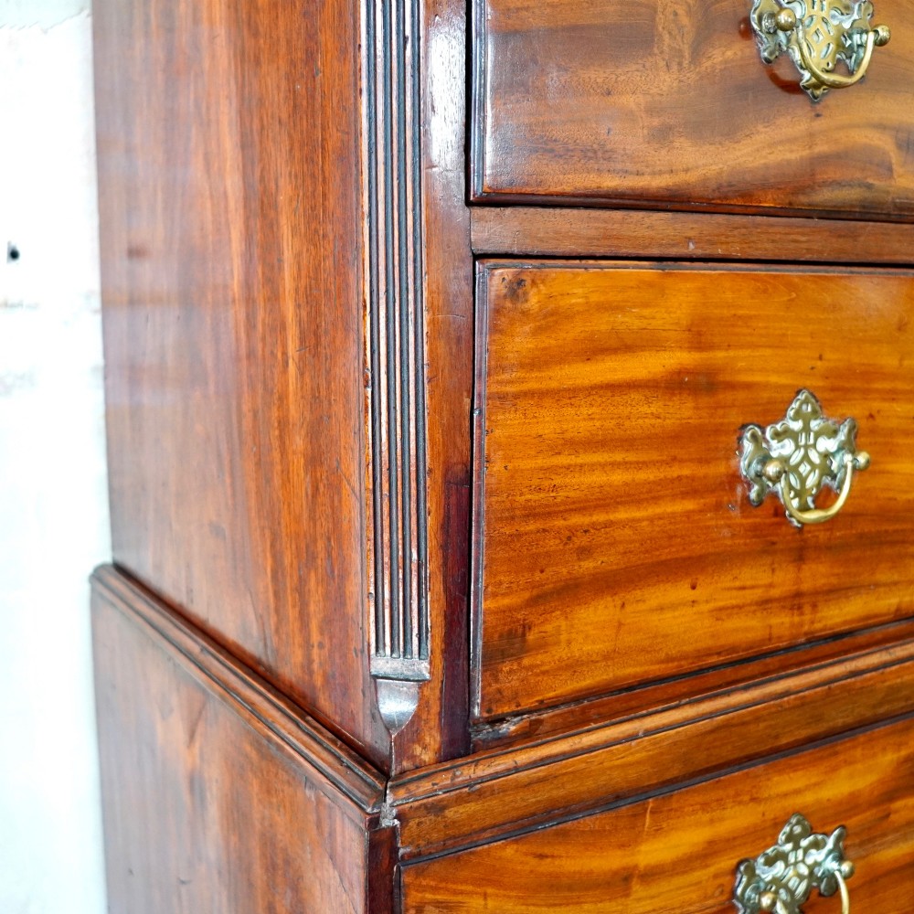 A late 18th-century George III mahogany chest on chest featuring brass swan-neck handles, keyhole escutcheons, dentil moulding, and bracket feet. View XI