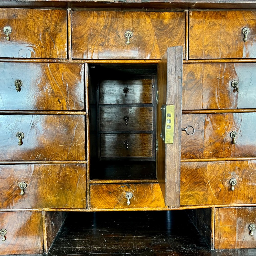 A tall Georgian walnut escritoire bureau featuring floral marquetry inlay on the fall-front flap and lower drawers with brass drop handles. View VIII