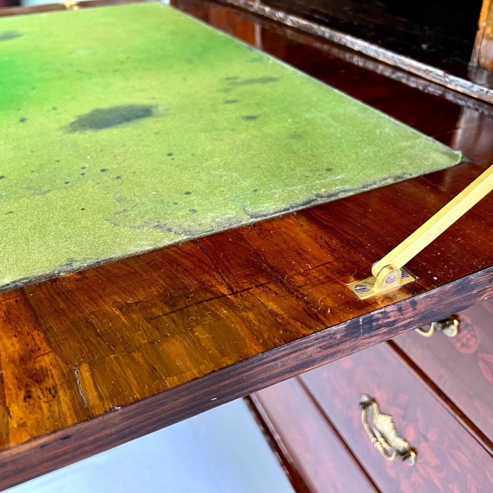 A tall Georgian walnut escritoire bureau featuring floral marquetry inlay on the fall-front flap and lower drawers with brass drop handles. View X