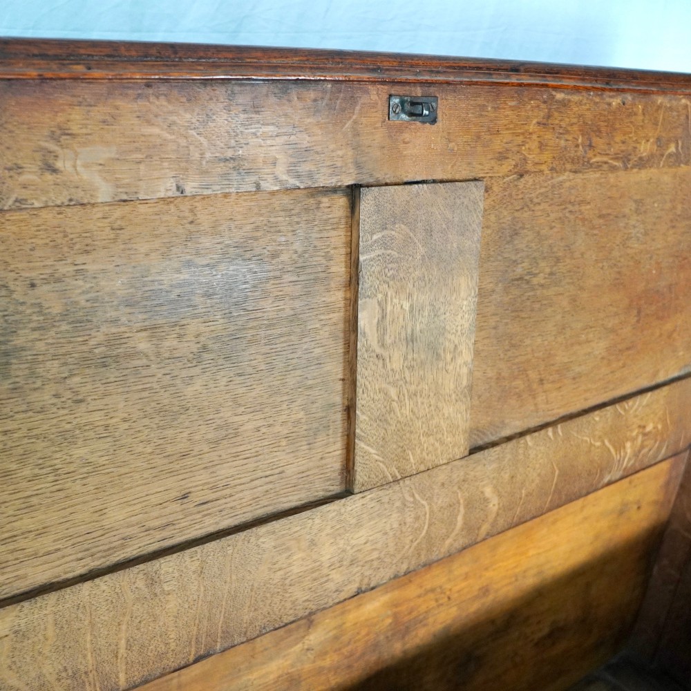 A Georgian oak and mahogany crossbanded Lancashire mule chest with brass handles and bracket feet. View III