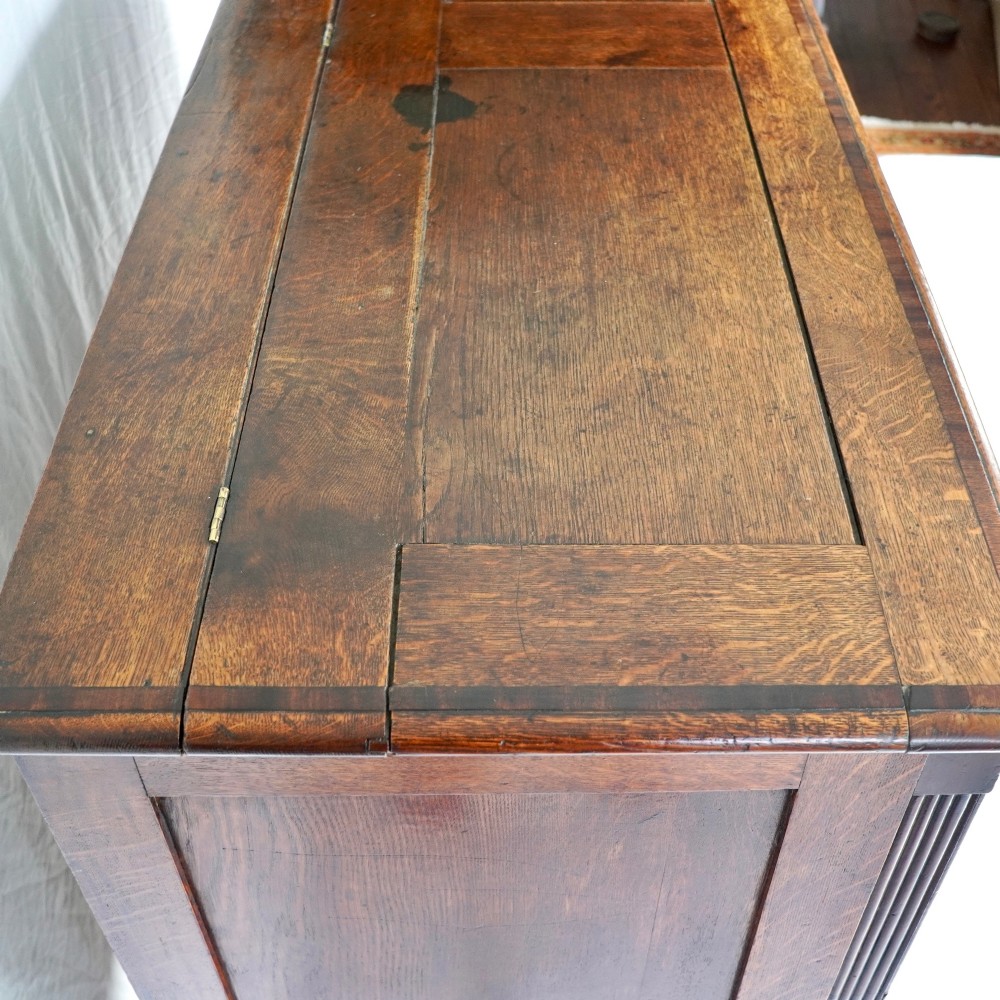 A Georgian oak and mahogany crossbanded Lancashire mule chest with brass handles and bracket feet. View VIII