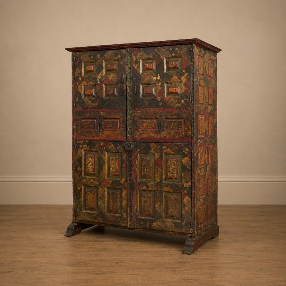 A tall seventeenth-century Spanish oak press cupboard featuring double upper and lower doors decorated with geometric raised panels and painted polychrome geometric patterns. View XIV