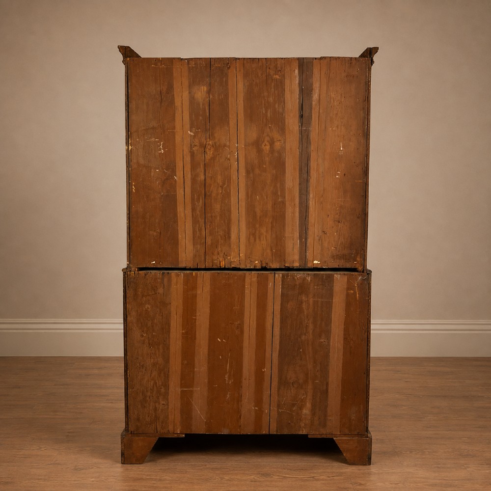 A tall George II two-part walnut chest on chest featuring figured burr walnut drawer fronts with line inlay, brass swan-neck handles, and bracket feet. View XIII