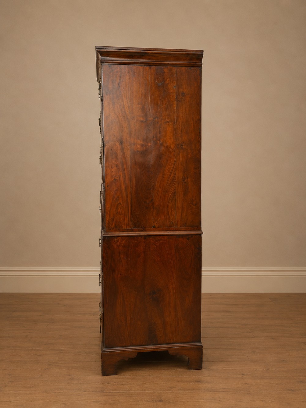 A tall George II two-part walnut chest on chest featuring figured burr walnut drawer fronts with line inlay, brass swan-neck handles, and bracket feet. View XV