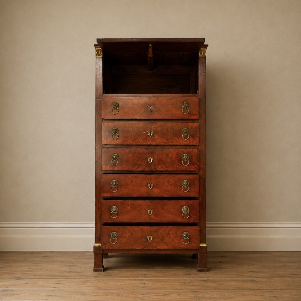 A 19th-century French Empire walnut secretaire cabinet featuring multiple drawers, brass lion-head ring handles, and fall-front writing compartments. View XIV