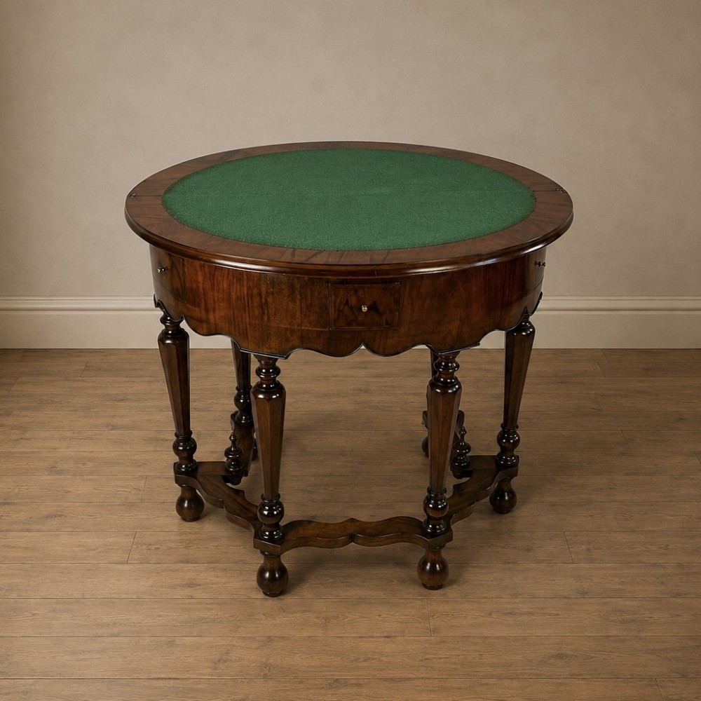A Victorian figured walnut demi-lune card table featuring a scalloped apron, small frieze drawers, multiple turned legs, and a shaped stretcher base. View XIV