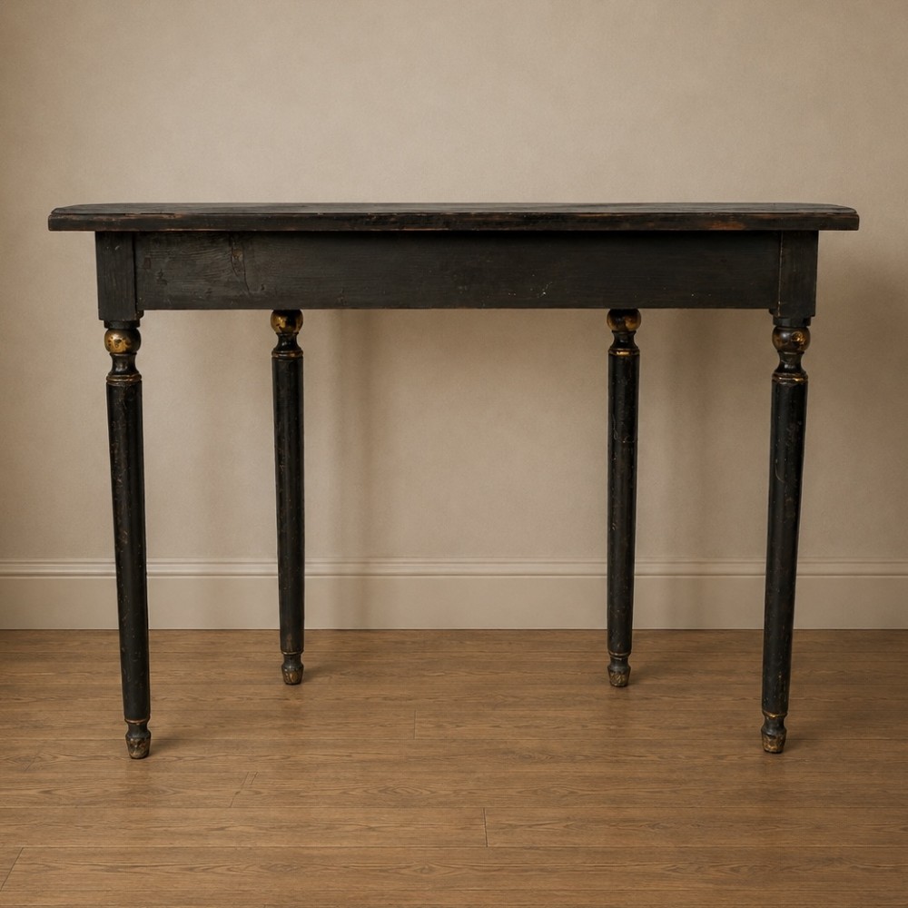 A Regency period semi-circular console table painted black with gold-gilded classical panel motifs and four slender turned legs. View XIII